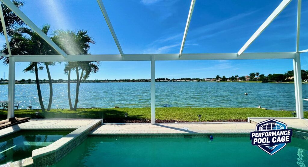 Pool enclosure painting white color using Sherwin Williams Direct to Metal Paint and Re-Screening with a panoramic view installation in Sarasota Florida